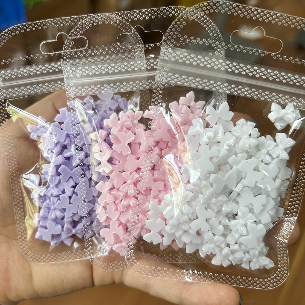 Trending Tech Accessories - 100 ชิ้นสีชมพูสีขาว Bowk Nail Art Charms